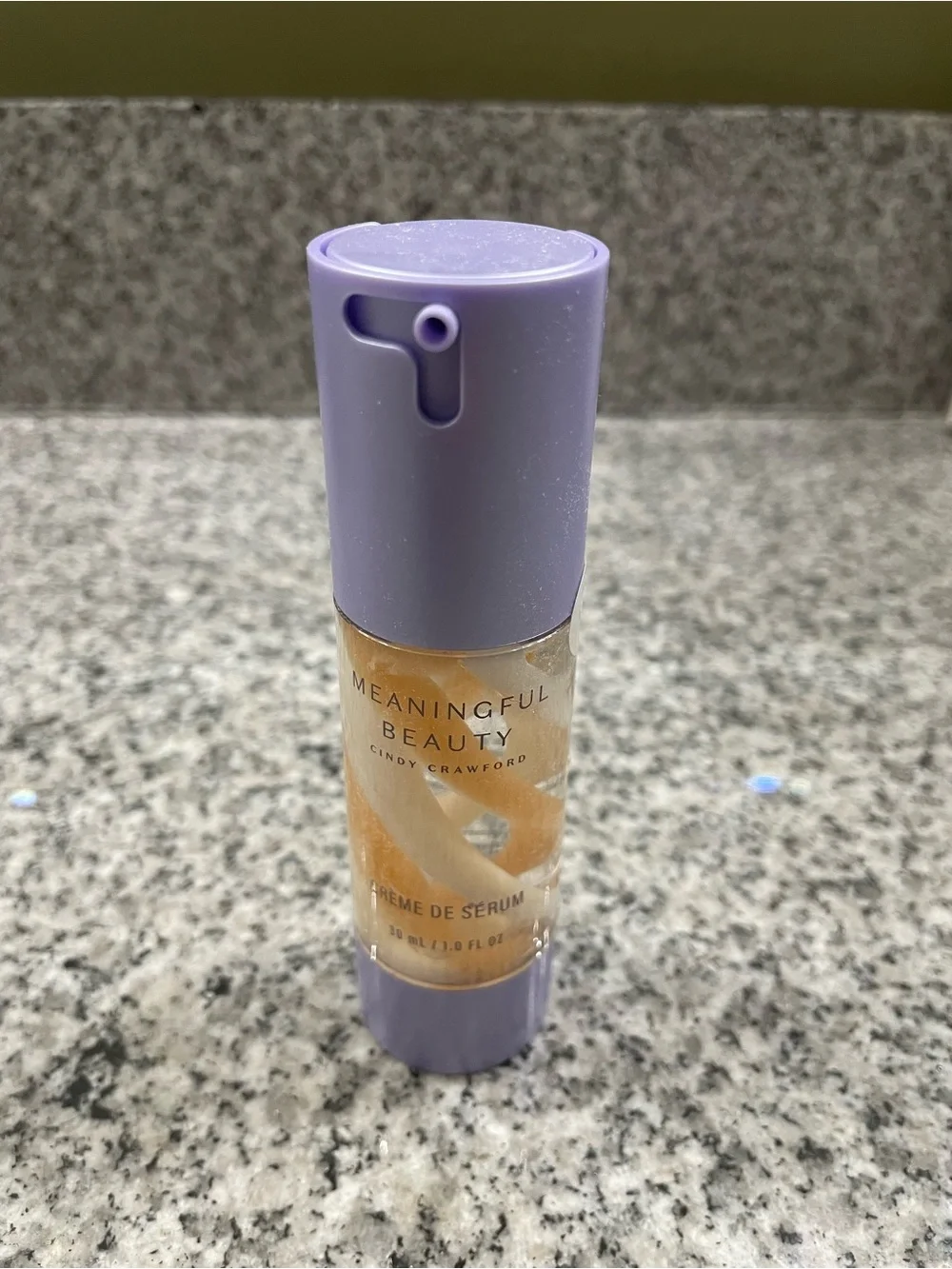 Meaningful Beauty Serum with Lavender Cap and Gold Swirls